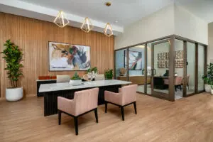 Meeting room at Alta Merita Apartments in Rancho Cucamonga, featuring a conference table with chairs.